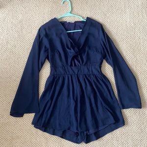 Flowy navy romper with front cut out!